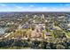 Aerial view of a homesite foundation surrounded by mature trees and a lake at 2569 Rogers Rd, Lakeland, FL 33812