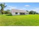 Spacious backyard featuring a well-maintained lawn, providing an ideal outdoor space at 2569 Rogers Rd, Lakeland, FL 33812