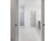 Modern bathroom with marble tile flooring and a glass-enclosed shower at 2569 Rogers Rd, Lakeland, FL 33812