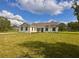 Charming single-story home with a well-maintained lawn and bright exterior at 2569 Rogers Rd, Lakeland, FL 33812