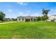 Exterior shot of a beautiful home featuring a spacious front yard at 2569 Rogers Rd, Lakeland, FL 33812