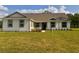 Inviting single-story home with a neat lawn and a welcoming front entrance at 2569 Rogers Rd, Lakeland, FL 33812