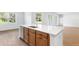 Kitchen with wood-tone cabinets, white countertop, and stainless steel dishwasher at 2569 Rogers Rd, Lakeland, FL 33812
