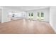 Open-concept living space featuring large windows and doors with tile flooring at 2569 Rogers Rd, Lakeland, FL 33812