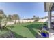 Spacious backyard with a white vinyl fence, lush grass, and landscaping at 5618 Winterbrook Way, Winter Park, FL 32792