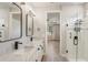 Bathroom featuring double vanities, modern fixtures, and glass enclosed shower at 5618 Winterbrook Way, Winter Park, FL 32792