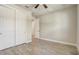 Neutral bedroom with wood-look floors, closet, and modern trim at 5618 Winterbrook Way, Winter Park, FL 32792