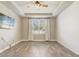 Bright bedroom featuring a ceiling fan, wood-look floors, and a serene, uncluttered space at 5618 Winterbrook Way, Winter Park, FL 32792