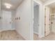 Bright entryway with wood-look tile flooring, a shiplap accent wall, and a modern light fixture at 5618 Winterbrook Way, Winter Park, FL 32792