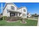 Beautiful two-story home featuring manicured landscaping, gray accents, and a welcoming front porch at 5618 Winterbrook Way, Winter Park, FL 32792