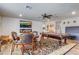 Entertainment room features a fireplace, a pool table, a ceiling fan, and a decorative area rug at 5618 Winterbrook Way, Winter Park, FL 32792