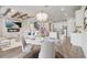 Open concept living space featuring a fireplace, dining area and kitchen with stainless steel appliances at 5618 Winterbrook Way, Winter Park, FL 32792