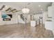 View of an open-concept living space featuring a fireplace, kitchen and staircase at 5618 Winterbrook Way, Winter Park, FL 32792
