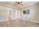 Main bedroom with a TV, ensuite bathroom, and a walk-in closet, with hardwood floors at 5618 Winterbrook Way, Winter Park, FL 32792