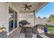 Covered patio featuring an outdoor dining set, a grill, and string lights for evening ambiance at 5618 Winterbrook Way, Winter Park, FL 32792