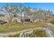 View of screened in back patio and pond behind the house at 21505 Castle View Ct, Leesburg, FL 34748