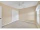 Bedroom featuring neutral carpet and a closet at 21505 Castle View Ct, Leesburg, FL 34748