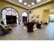 Inviting clubhouse lobby featuring comfortable seating, warm lighting, and tasteful decor for a welcoming atmosphere at 21505 Castle View Ct, Leesburg, FL 34748