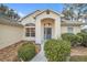 Charming home exterior featuring a well-manicured lawn, mature trees, and welcoming curb appeal at 21505 Castle View Ct, Leesburg, FL 34748