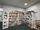 Game room filled with shelves of board games and puzzles for entertainment at 21505 Castle View Ct, Leesburg, FL 34748