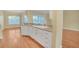 Updated kitchen with modern appliances, breakfast bar, and hardwood floors at 21505 Castle View Ct, Leesburg, FL 34748