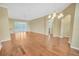 Spacious living room with hardwood floors, a chandelier, and sliding glass doors at 21505 Castle View Ct, Leesburg, FL 34748