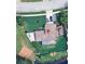 Aerial view of the property's layout including the spacious backyard, driveway, and nearby baseball field at 223 W Panama Rd, Winter Springs, FL 32708