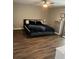 Cozy bedroom featuring a ceiling fan, laminate flooring, and a serene atmosphere at 223 W Panama Rd, Winter Springs, FL 32708