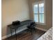 Bedroom featuring desk next to shuttered window with vinyl plank flooring at 223 W Panama Rd, Winter Springs, FL 32708