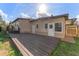 Backyard featuring a wood deck perfect for outdoor entertaining at 2730 Woodland Hills Ave, Lakeland, FL 33803