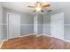 Large bedroom offering hardwood floors, a ceiling fan, and a closet providing ample space at 2730 Woodland Hills Ave, Lakeland, FL 33803