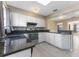 Contemporary kitchen with granite counters and stainless steel appliances at 2730 Woodland Hills Ave, Lakeland, FL 33803