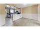 Open kitchen area with neutral paint and updated appliances at 2730 Woodland Hills Ave, Lakeland, FL 33803