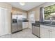 Bright kitchen featuring stainless steel appliances, and a large refrigerator at 2730 Woodland Hills Ave, Lakeland, FL 33803