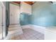 Laundry room featuring tiled floors and a door that leads to the exterior at 2730 Woodland Hills Ave, Lakeland, FL 33803