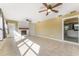 Bright living room features tiled floors, a white brick fireplace, and natural light at 2730 Woodland Hills Ave, Lakeland, FL 33803