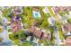 Aerial view of the townhome community with pool, landscaping, and surrounding greenery at 3808 Ne 17Th St # 3808, Ocala, FL 34470