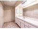 Bathroom featuring a vanity with built-in storage and a large mirror at 3808 Ne 17Th St # 3808, Ocala, FL 34470