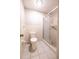 Bright bathroom with a tiled shower, toilet, and handicap bar at 3808 Ne 17Th St # 3808, Ocala, FL 34470