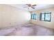 Bedroom featuring natural light from two windows and a ceiling fan at 3808 Ne 17Th St # 3808, Ocala, FL 34470