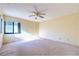 Bedroom featuring natural light from one window and a ceiling fan at 3808 Ne 17Th St # 3808, Ocala, FL 34470