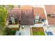 Overhead view of townhome with attached garage, landscaping, and a traditional roof at 3808 Ne 17Th St # 3808, Ocala, FL 34470