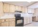 Kitchen view showcasing cabinets, black oven, white countertops, and tile backsplash at 3808 Ne 17Th St # 3808, Ocala, FL 34470