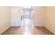 Bright and open living room with clean white walls and wood-look flooring at 3808 Ne 17Th St # 3808, Ocala, FL 34470