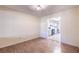 Bright living room with wood floors that flow into kitchen with lots of light at 3808 Ne 17Th St # 3808, Ocala, FL 34470