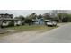 Exterior street view of light blue house with a white SUV in the driveway at 605 Van Ness St, Daytona Beach, FL 32114