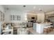 Cozy living space with open floorplan, kitchen with seating, and comfortable couch at 165 River Front Way, Edgewater, FL 32141