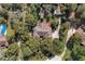 Aerial view of home featuring a spacious yard, pool, and mature trees at 5670 Sw 34Th St, Ocala, FL 34474