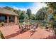 Spacious backyard with a dining set on the deck and lots of trees at 5670 Sw 34Th St, Ocala, FL 34474