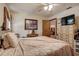 A comfortable bedroom features patterned bedding, a ceiling fan and matching dressers at 5670 Sw 34Th St, Ocala, FL 34474